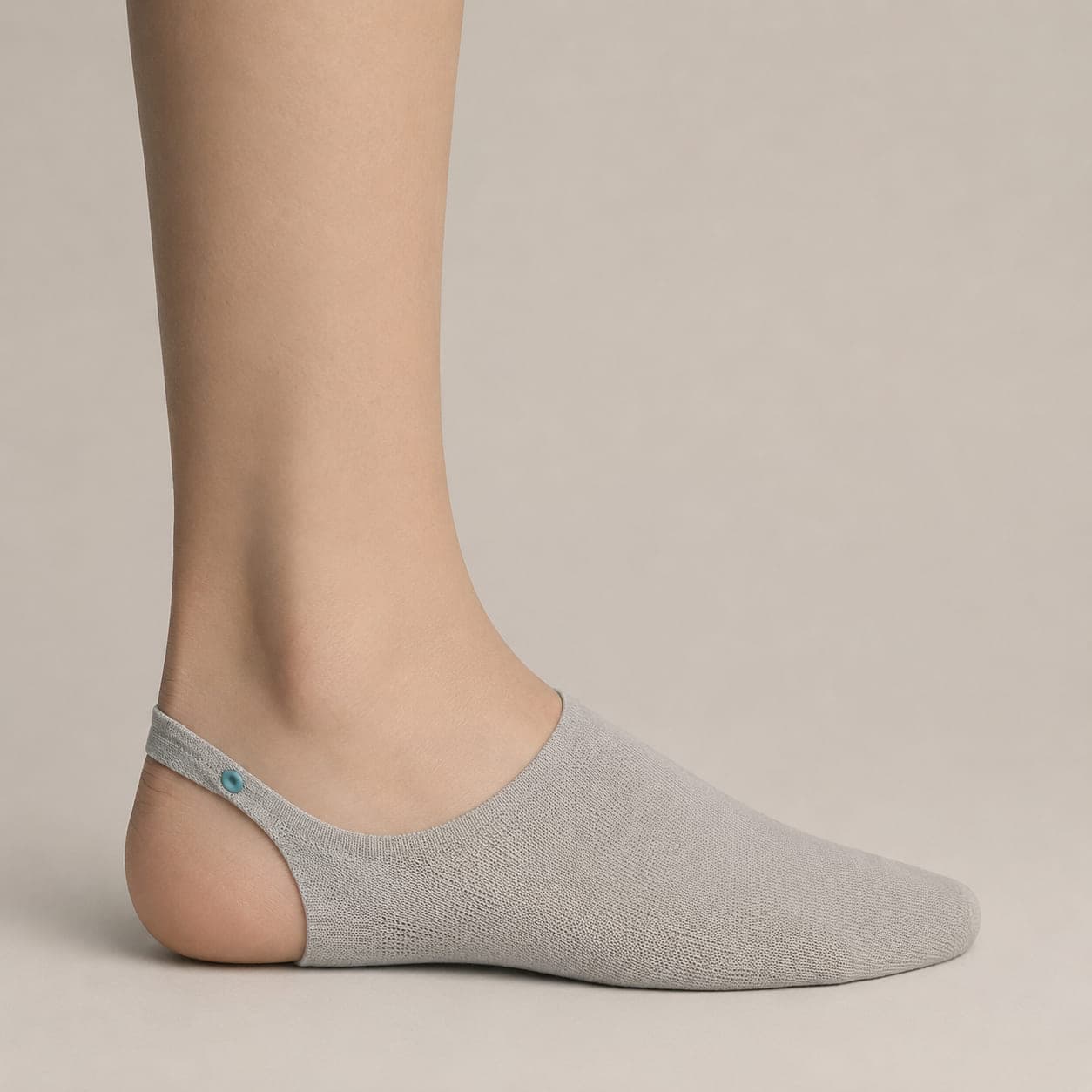Deep 26 worn on a foot, seen from the side, with the cuff edge visible above the heel.