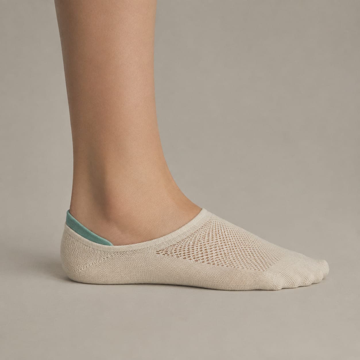 Deep 30 Mesh worn on a foot, seen from the side, with the cuff edge visible above the heel.