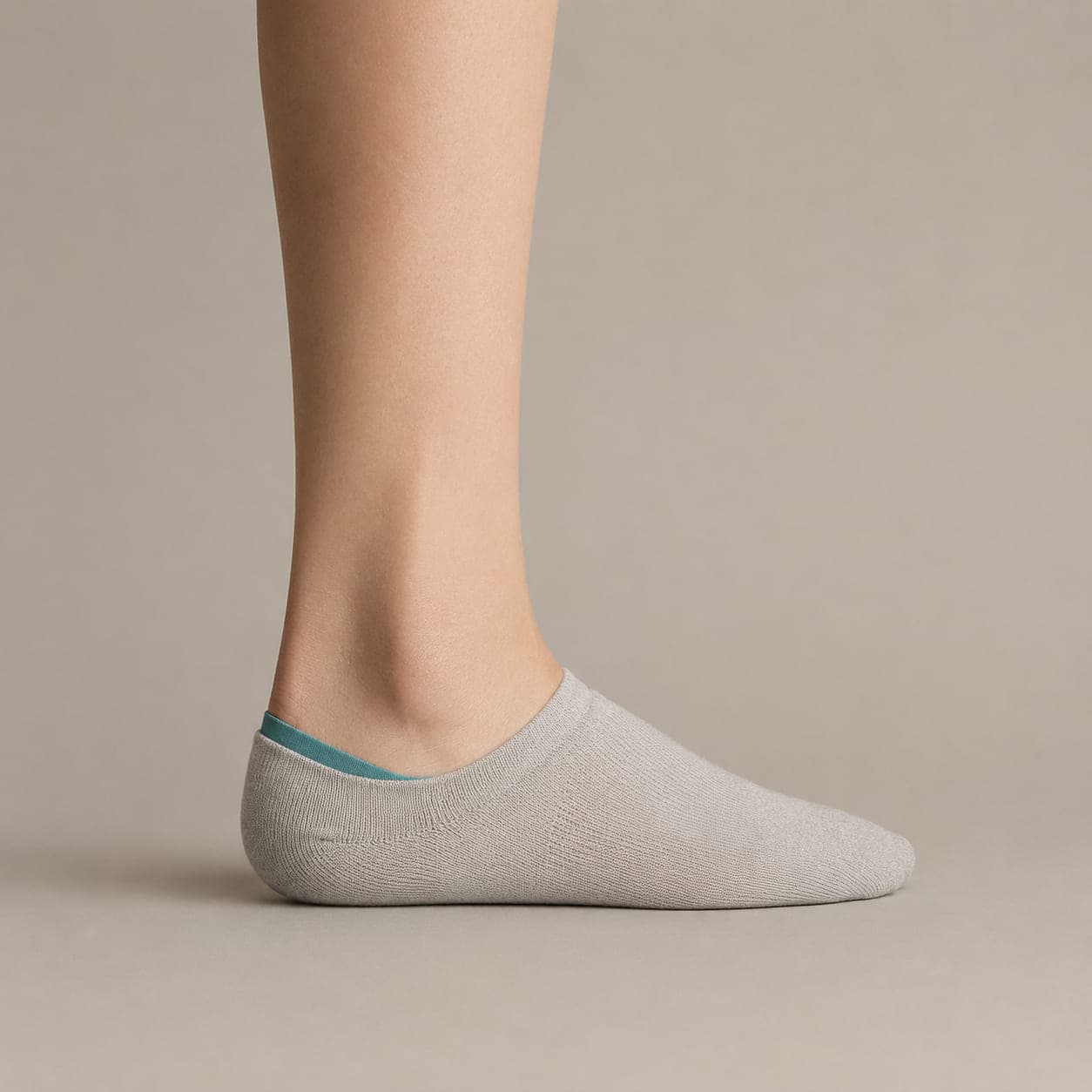 Hidden 42 worn on a foot, seen from the side, with the cuff edge visible above the heel.