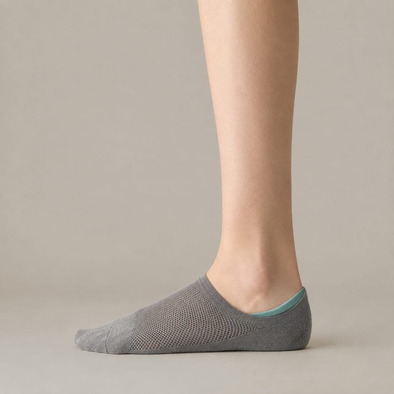Hidden 42 Mesh worn on a foot, seen from the side, with the cuff edge visible above the heel.