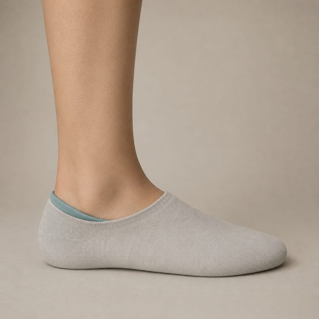 Hidden 42 Wide worn on a foot, seen from the side, with the cuff edge visible above the heel.