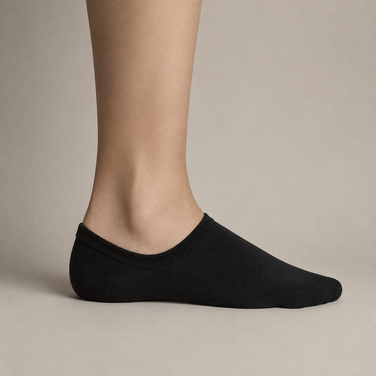 Boat 52 worn on a foot, seen from the side, with the cuff edge visible above the heel.