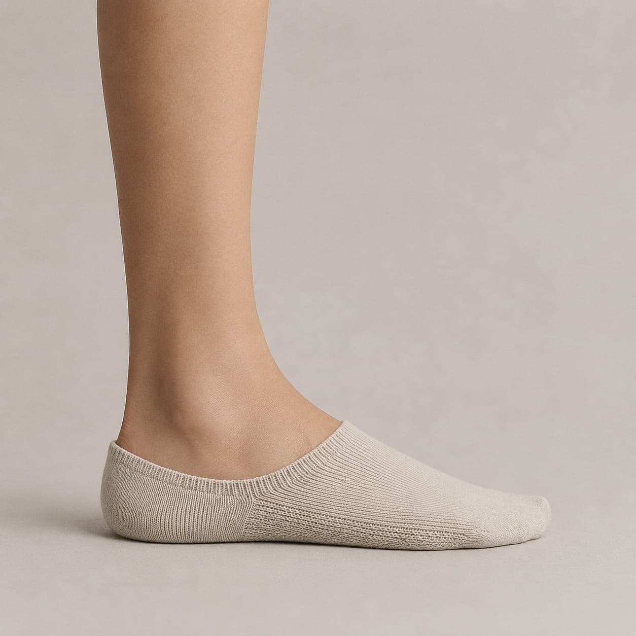 Boat 52 Cushion worn on a foot, seen from the side, with the cuff edge visible above the heel.