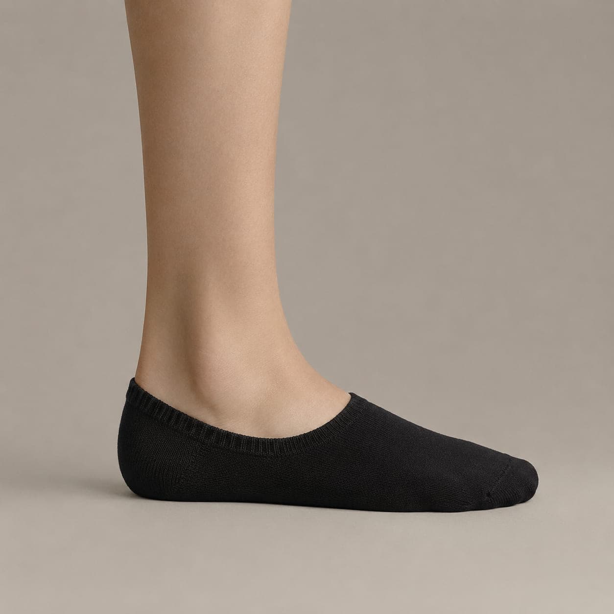 Band 38 worn on a foot, seen from the side, with the cuff edge visible above the heel.