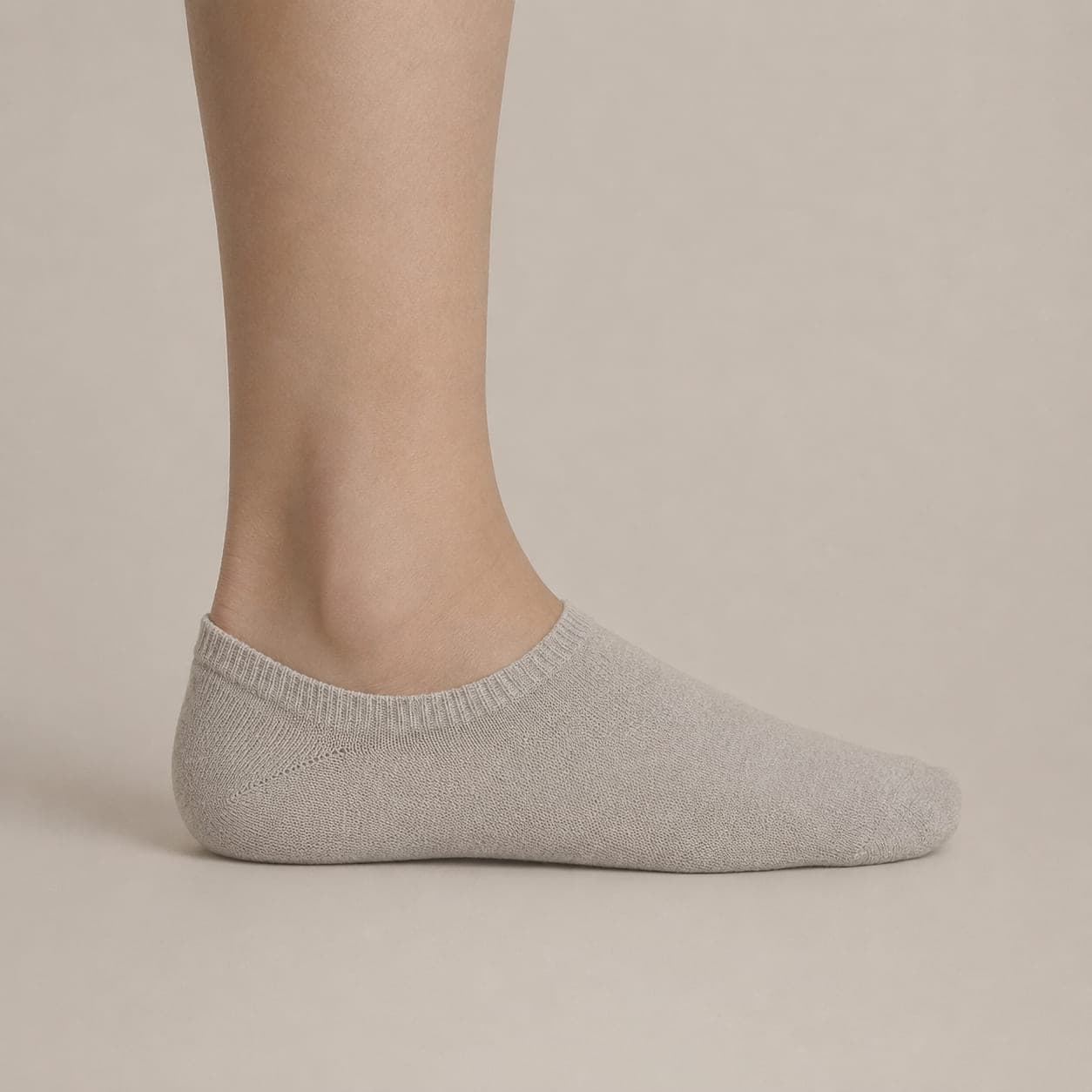 Band 42 worn on a foot, seen from the side, with the cuff edge visible above the heel.