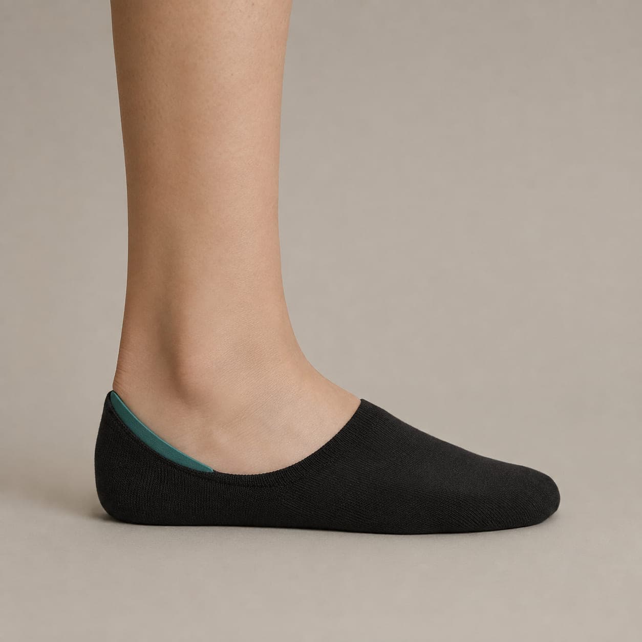 Grip Arc 8 worn on a foot, seen from the side, with the cuff edge visible above the heel.
