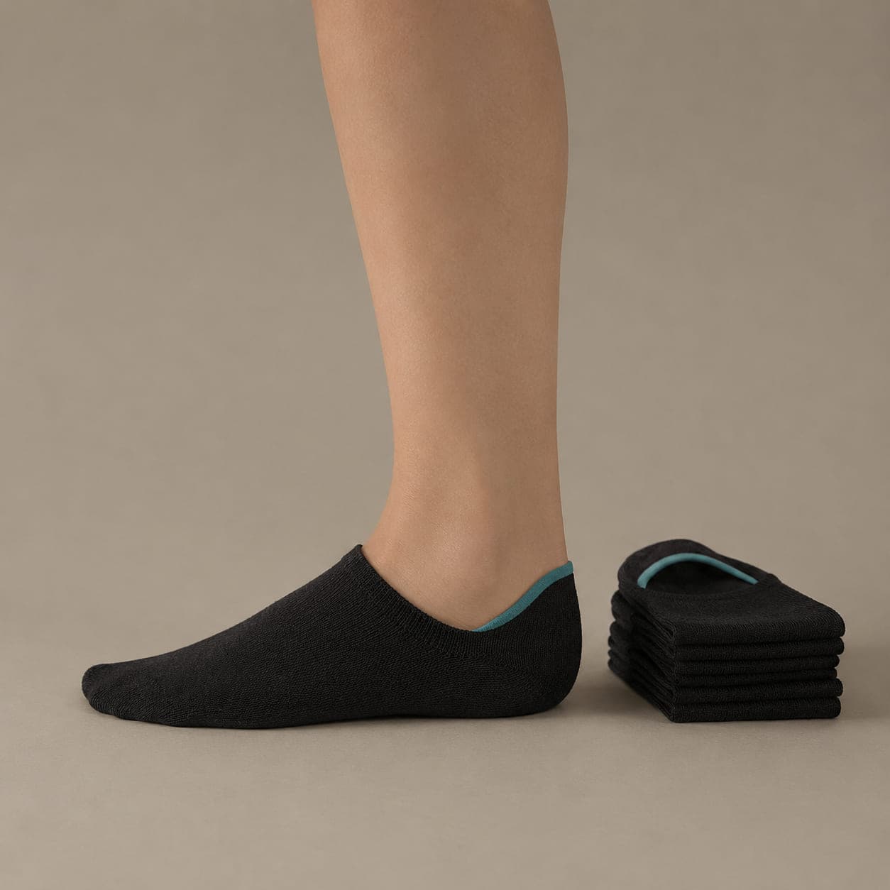 Deep 30 three-pack worn on a foot, seen from the side, with the cuff edge visible above the heel.