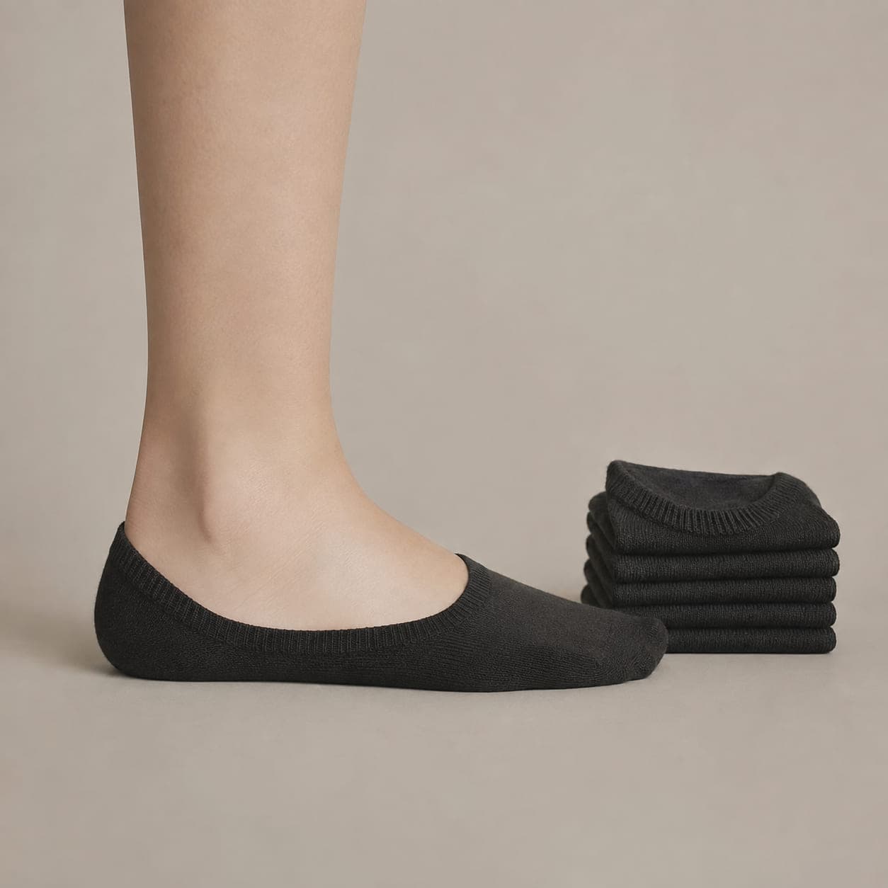 Band 38 three-pack worn on a foot, seen from the side, with the cuff edge visible above the heel.